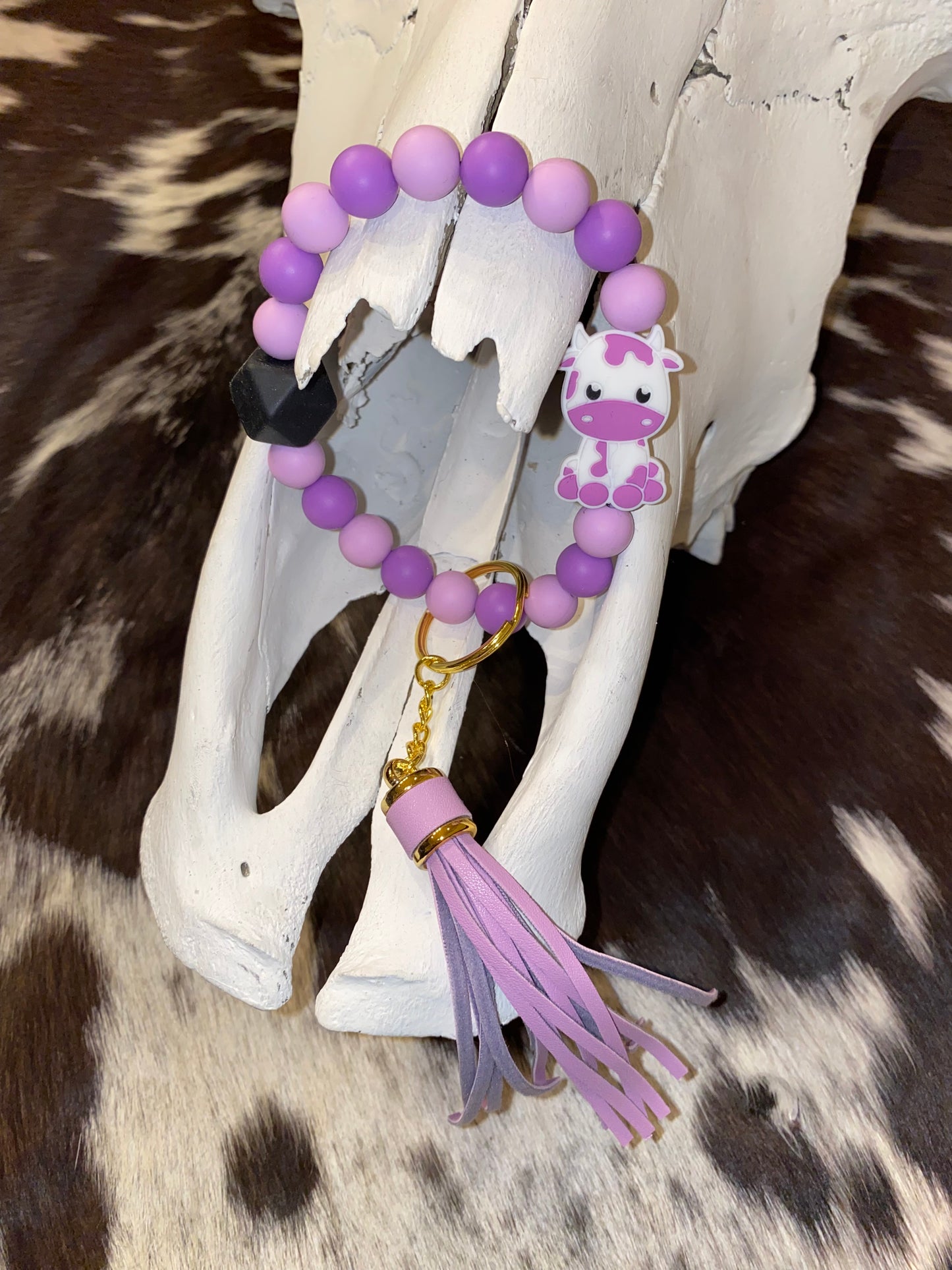 Purple and black cow keychain