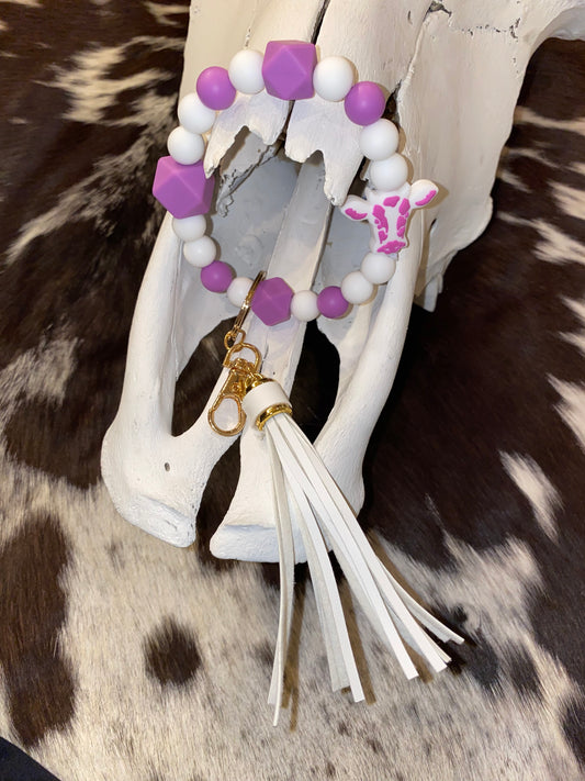 Purple and white cow keychain