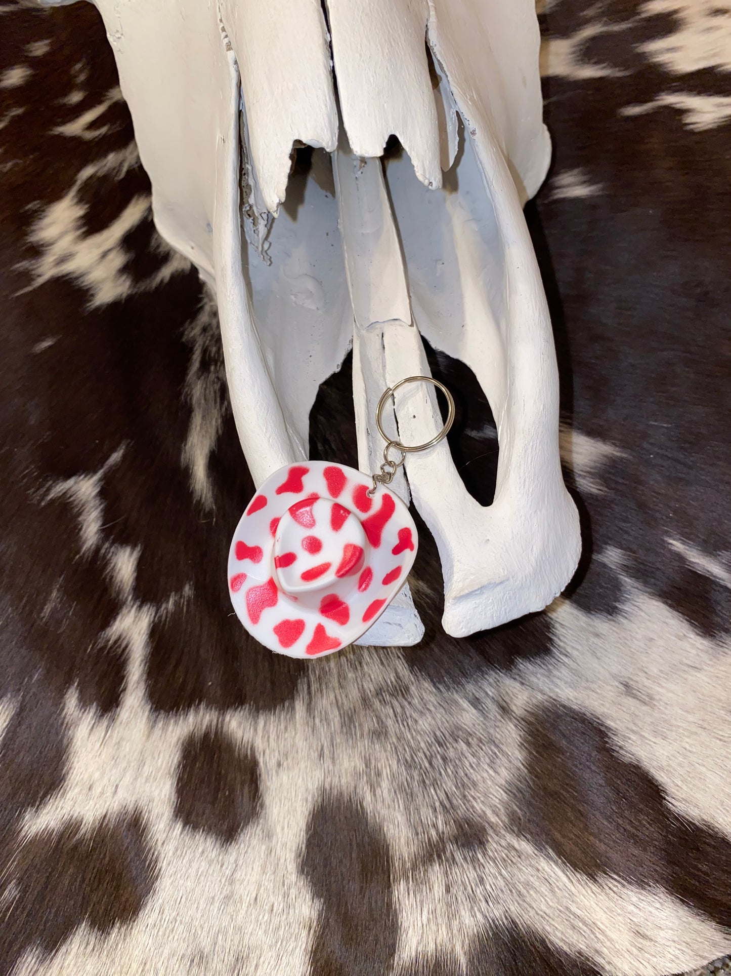 Pink cow print hat key charm